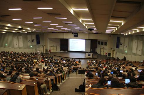 You see a picture of the people at the Fosdem conference.