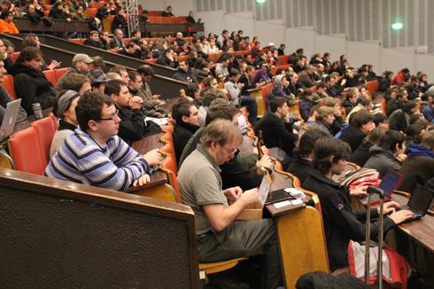 You see a picture of the people at the Fosdem conference.